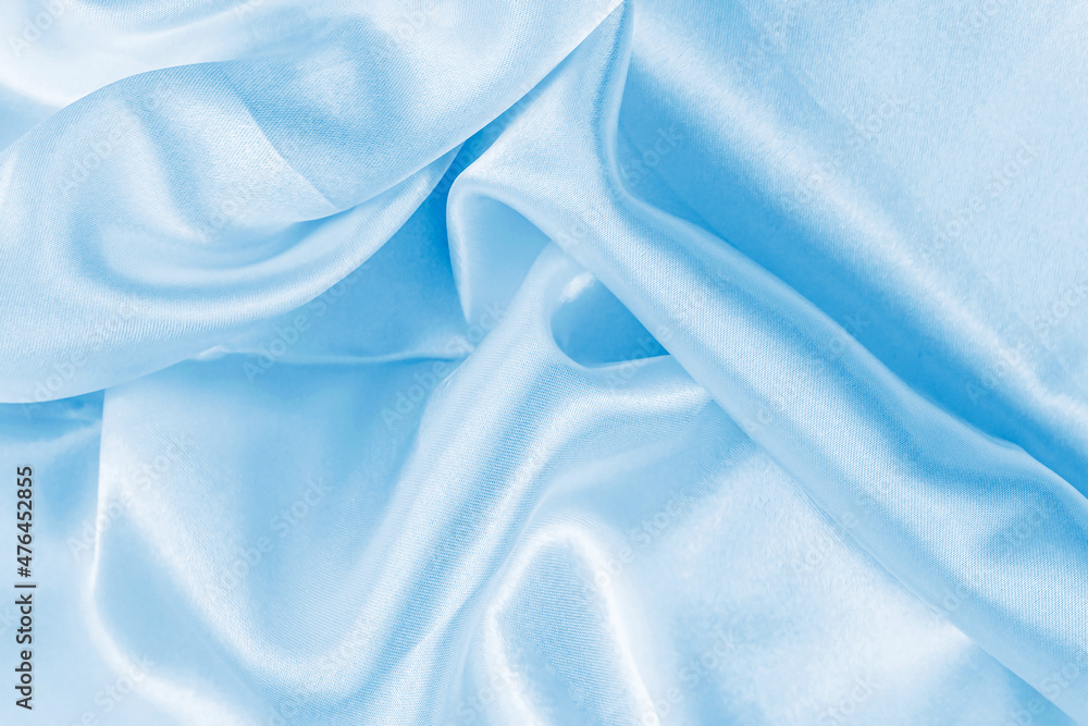 Light blue color silk wavy textile pattern as a smooth textured