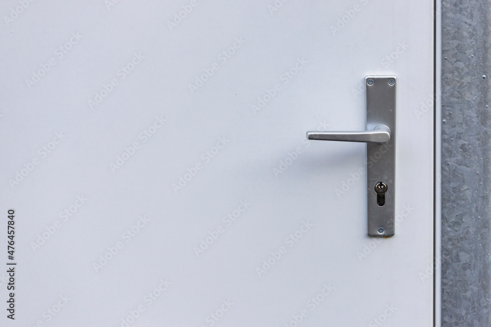 background of white doors with door lock and handle background of white doors with door lock and handle