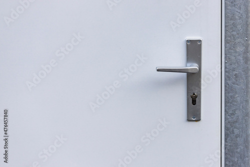 background of white doors with door lock and handle