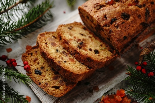 Homemade Xmas fruit cake or Indian tutti frutti bread on Christmas holiday background, selective focus