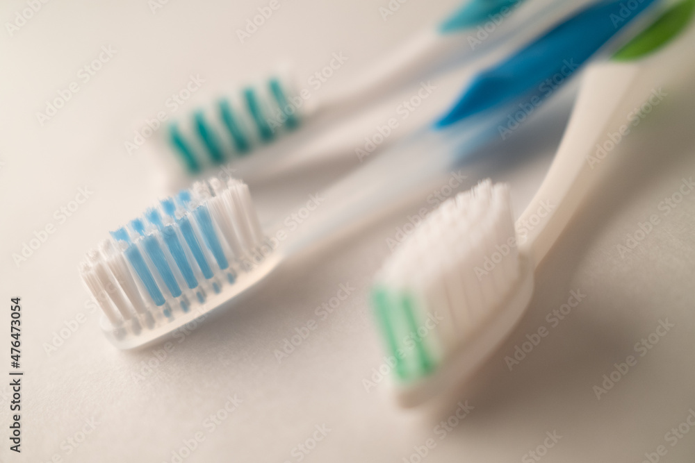 Photograph with Shallow Depth of Field of Toothbrushes on a White Background Photograph with Shallow Depth of Field of Toothbrushes on a White Background