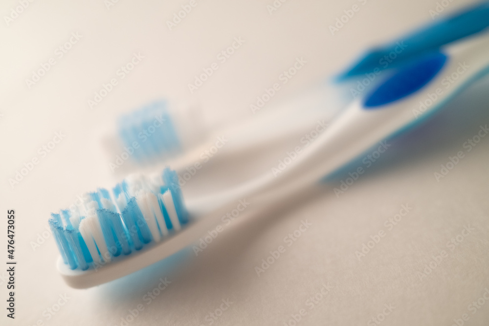 Photograph with Shallow Depth of Field of Toothbrushes on a White Background