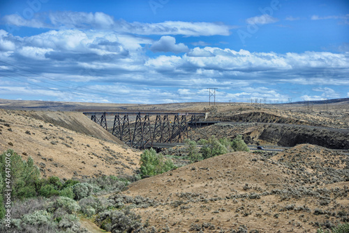 Fototapeta Train trestle over desert canyon
