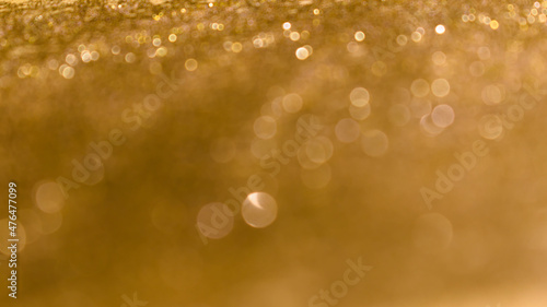 Obraz na płótnie Golden shiny abstract background with round lights. w salonie