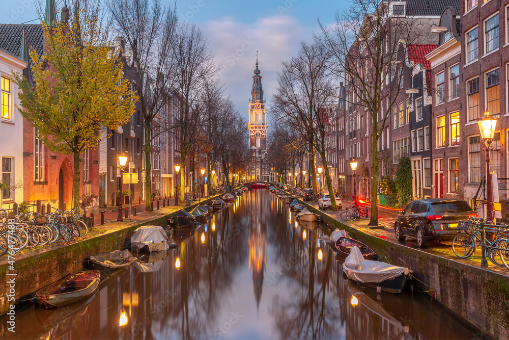 Evening Amsterdam canal Groenburgwal with Zuiderkerk, southern church, Holland, Netherlands.