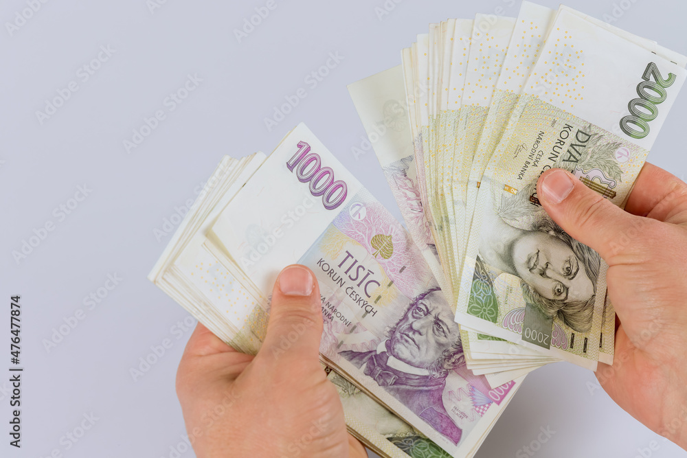 Czech koruna banknotes in the hands of a man Czech koruna banknotes in the hands of a man