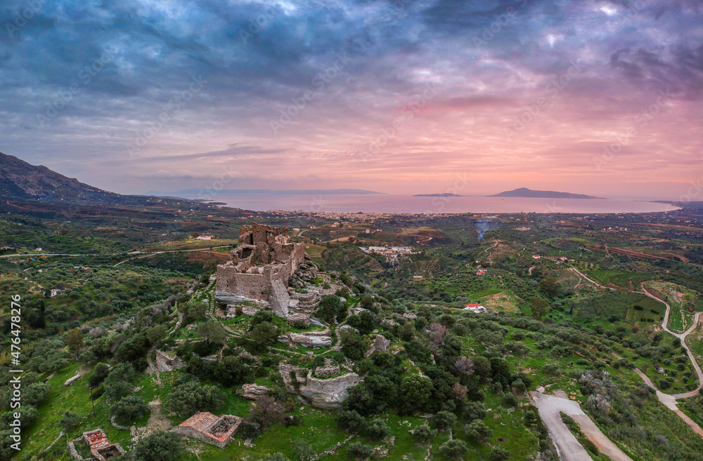 Obraz premium Aerial view of the Castle of Vatika or Castle of Agia Paraskevi at sunset. The castle is located in Mesohori village and has a wonderful view of Neapolis town and Elafonissos island, Laconia, Greece.
