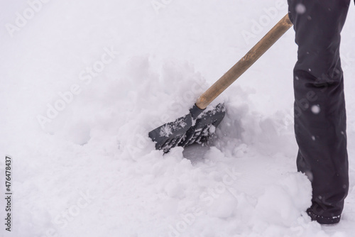 Shoveling snow. Snow drift cleaning.