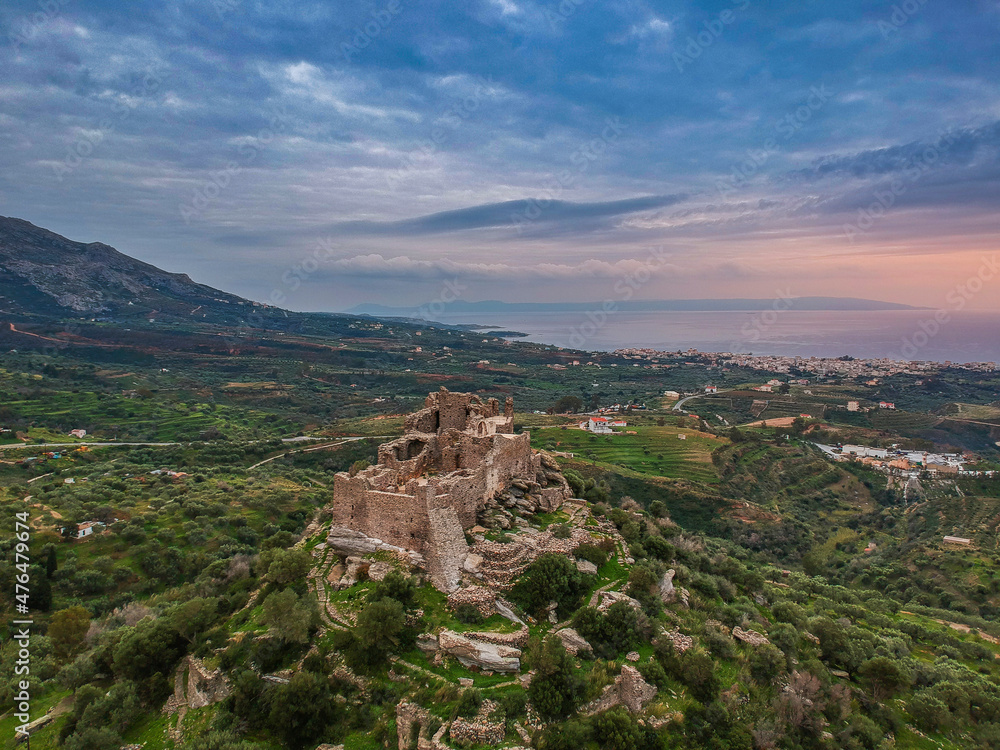 Aerial view of the Castle of Vatika or Castle of Agia Paraskevi at sunset. The castle is located in Mesohori village and has a wonderful view of Neapolis town and Elafonissos island, Laconia, Greece.