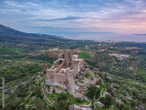 Aerial view of the Castle of Vatika or Castle of Agia Paraskevi at sunset. The castle is located in Mesohori village and has a wonderful view of Neapolis town and Elafonissos island, Laconia, Greece. © panosk18