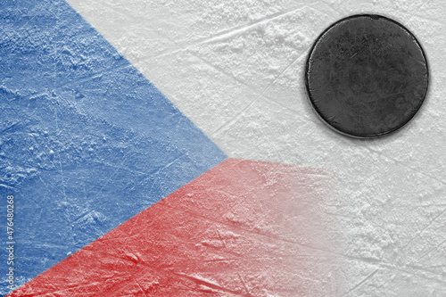 Hockey puck lying on the ice of the arena with the image of the Czech flag