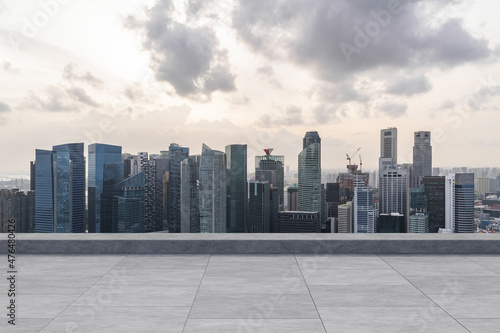 Panoramic Singapore skyline view, concrete observatory deck on rooftop, sunset. Asian corporate and residential lifestyle. Financial city downtown, real estate. Product display mockup empty roof