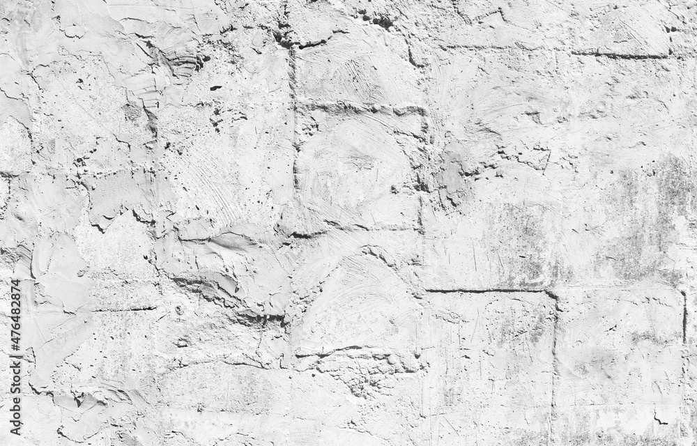 Fototapeta premium Old white stone wall, frontal background photo