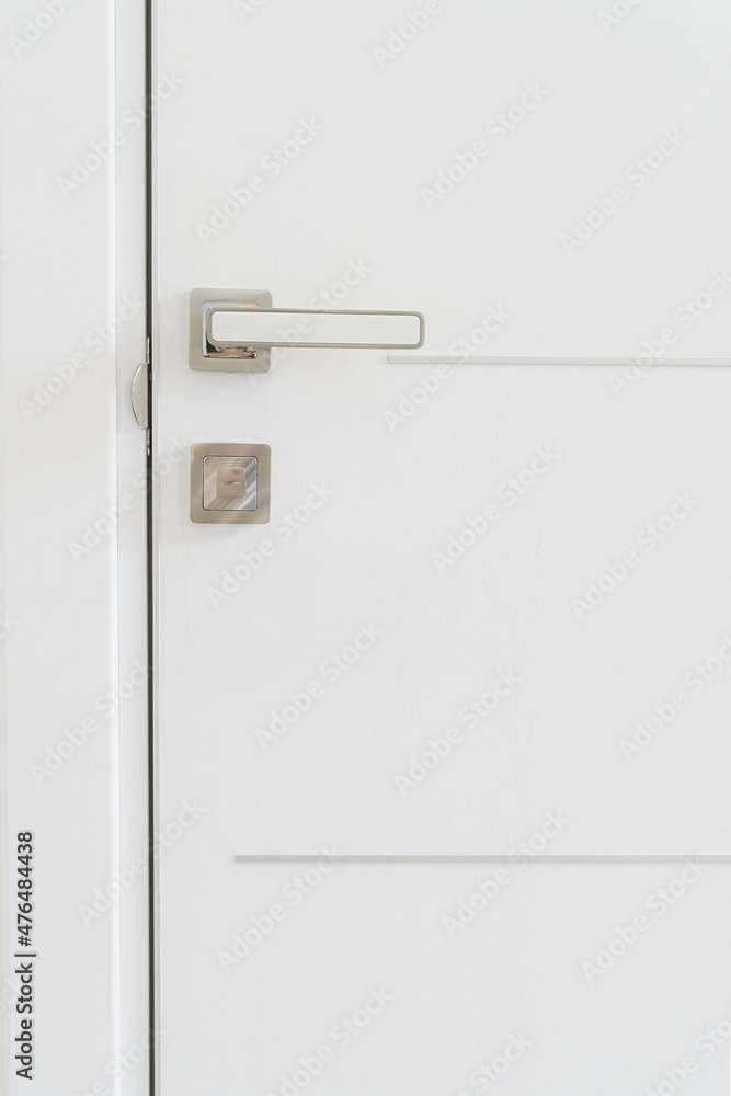 Handle on a white door close up Handle on a white door close up