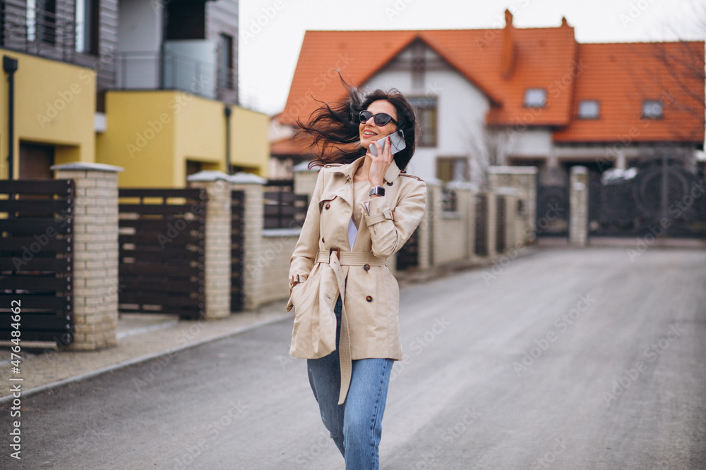 Young business woman oitside by the house Young business woman oitside by the house