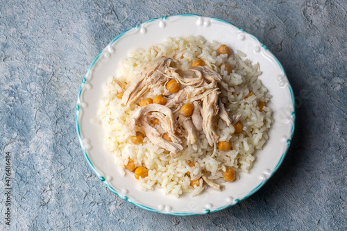 Traditional delicious Turkish food; Rice with chickpeas and chicken (Turkish name; Tavuklu nohutlu pilav or pilaf) photo