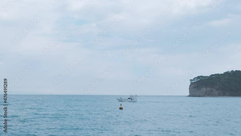 Beautiful Mediterranean Ocean blue white clouds. Boat on waves Beautiful Mediterranean Ocean waves with horizon in distance. Cruise ship vacation in Europe. Environmental and nature with deep blue sea Beautiful Mediterranean Ocean blue white clouds. Boat on waves Beautiful Mediterranean Ocean waves with horizon in distance. Cruise ship vacation in Europe. Environmental and nature with deep blue sea