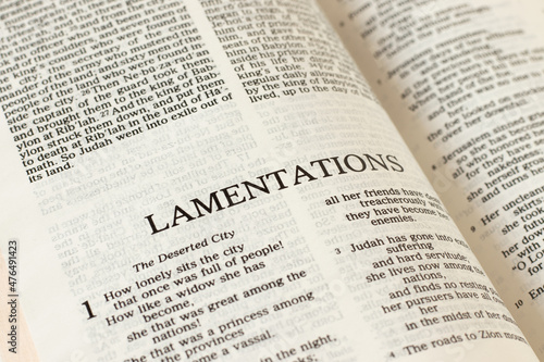 Lamentations open Bible Book. A close-up. Studying Old Testament Holy Scriptures Jeremiah prophet. Christian biblical concept of grief, sin, forgiveness by God Jesus Christ.