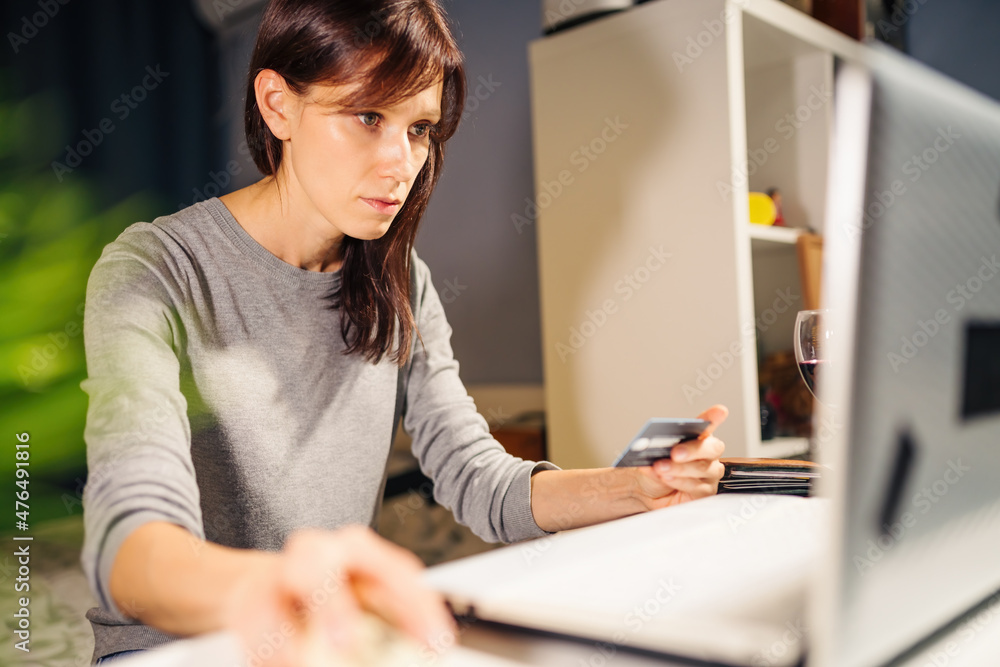 Internet transactions. Woman making online payment with credit card and laptop, paying via internet Internet transactions. Woman making online payment with credit card and laptop, paying via internet