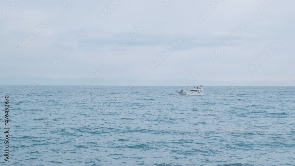 Beautiful Mediterranean Ocean blue white clouds. Boat on waves Beautiful Mediterranean Ocean waves with horizon in distance. Cruise ship vacation in Europe. Environmental and nature with deep blue sea Beautiful Mediterranean Ocean blue white clouds. Boat on waves Beautiful Mediterranean Ocean waves with horizon in distance. Cruise ship vacation in Europe. Environmental and nature with deep blue sea