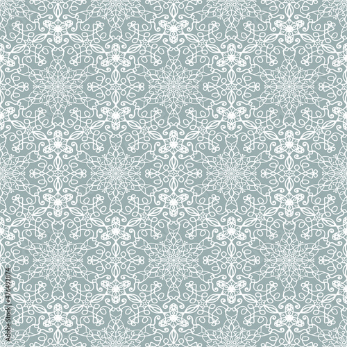Lace seamless ornament. White lace on a gray background. Vector embroidery.
