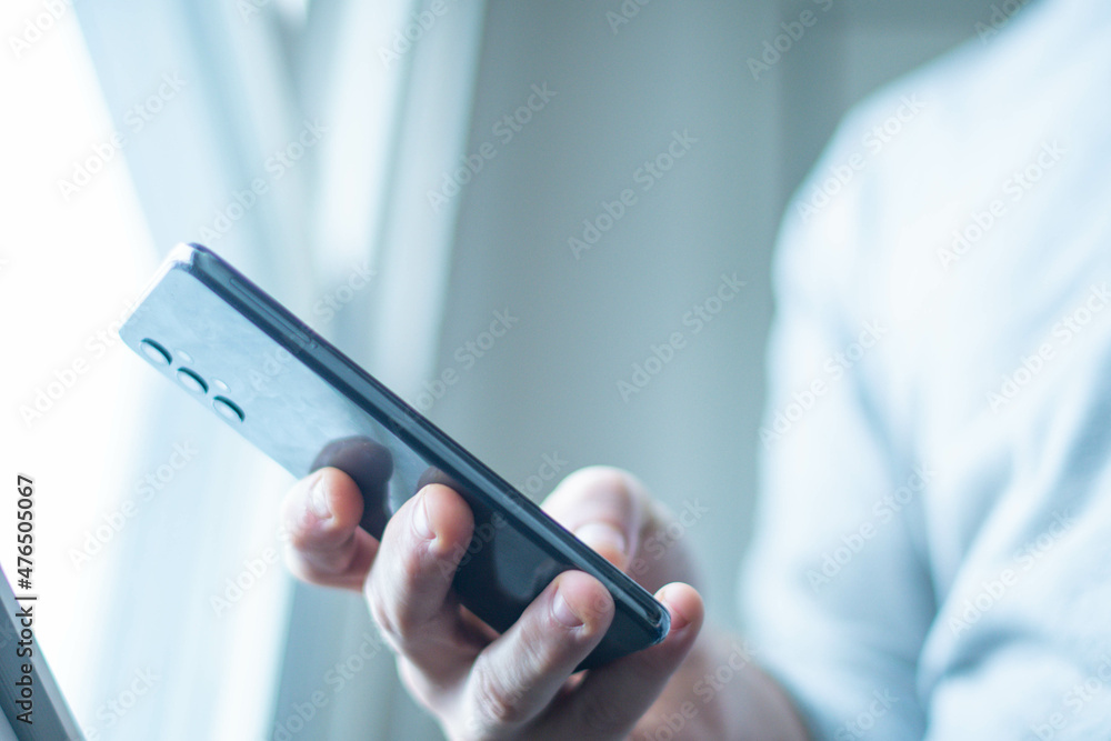 Phone holding next to bright natural light. Phone holding next to bright natural light.