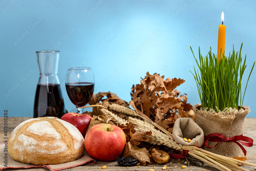 Christmas oak tree, candle, bread and dried fruits Christmas oak tree, candle, bread and dried fruits