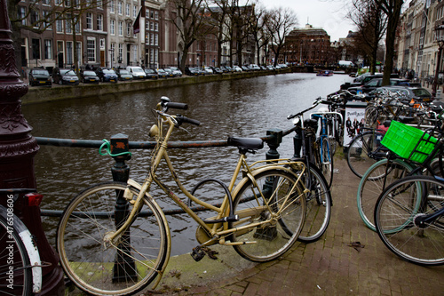Gold Bike on Canal in Amsterdam, Netherlands