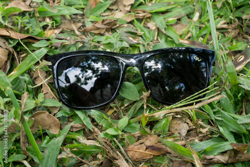 Sunglasses on the grass. Good illustration of lifestyle in nature