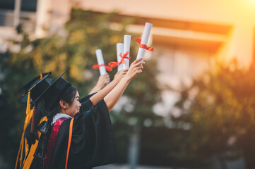 graduates wearing black hats holding university graduation certificates,Concept education congratulation. Graduation Ceremony ,Congratulated the graduates in University.