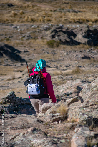 woman walking from esplada makes trekking in a mountain photo