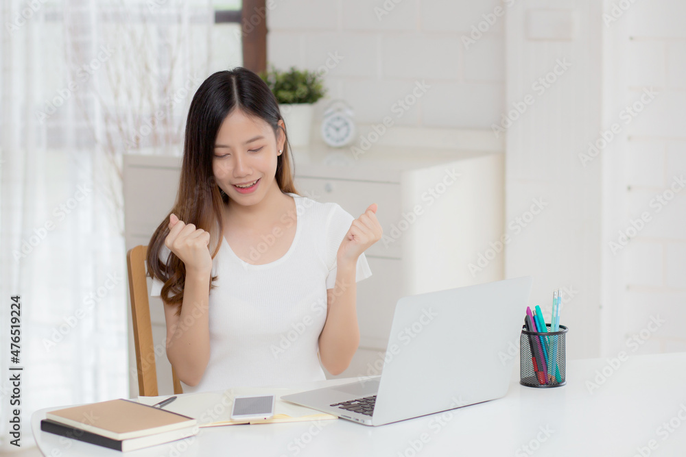 Young asian woman confident working at home with laptop computer and thinking idea for planning, freelance happy girl excited and success using notebook thoughtful and writing, business concept. Young asian woman confident working at home with laptop computer and thinking idea for planning, freelance happy girl excited and success using notebook thoughtful and writing, business concept.