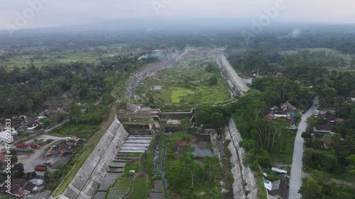 Aerial video of the sabo dam holding back the cold lava of Mount Merapi on the Gendol river, Yogyakarta, Indonesia. photo