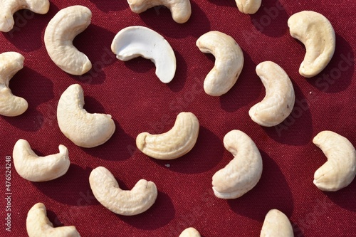 Cashew nuts on red background