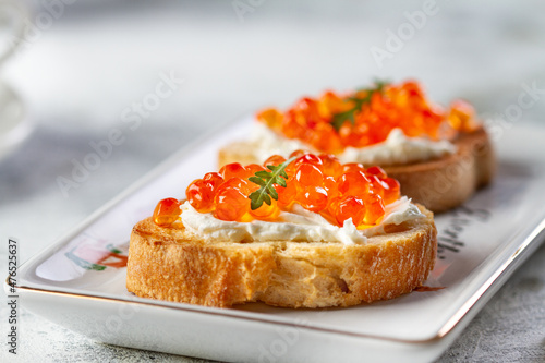 Bruschetta with cheese and red caviar