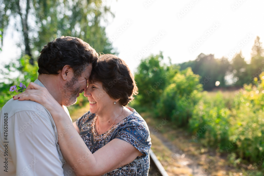 Happy mature couple. Date and walk, portrait of two spouses. Front view. Happy mature couple. Date and walk, portrait of two spouses. Front view.