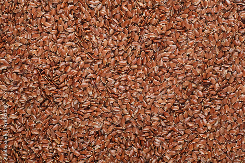 Brown flax seeds as a background, top view. Brown flax seeds as a background, top view.