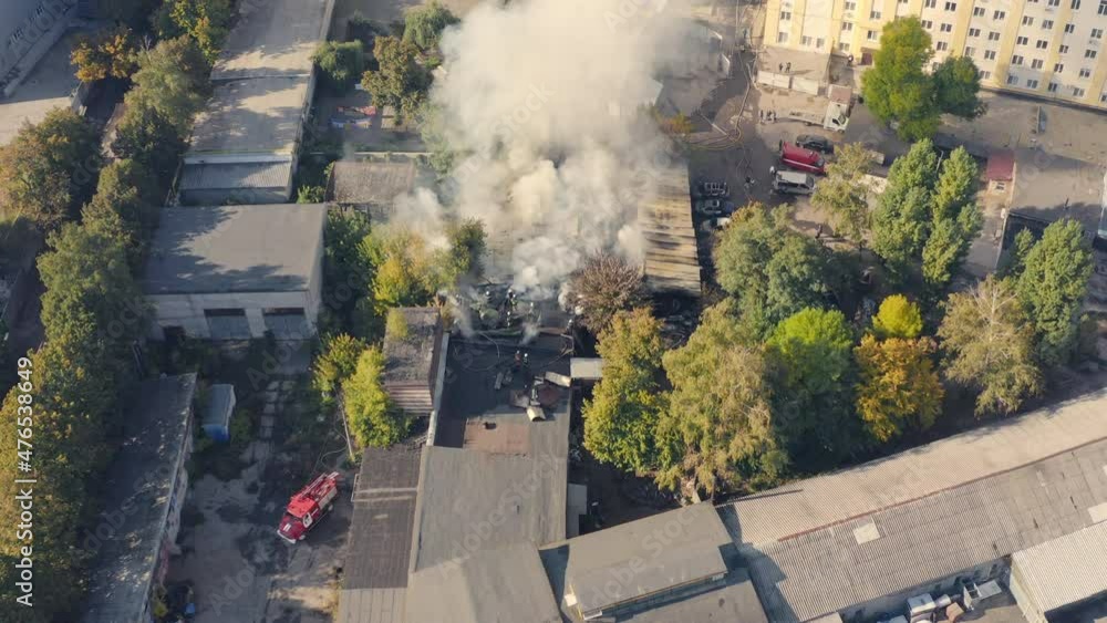 Fire brigade works to put out a fire with smoke in the city: drone ...