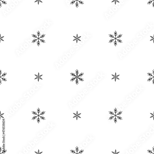 Winter seamless pattern with cartoon hand drawn snowflakes on white background.