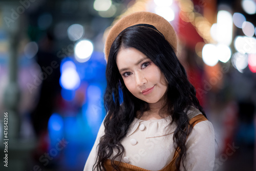 Portrait of an Asian woman at Christmas and various bokeh on her own lifestyle.