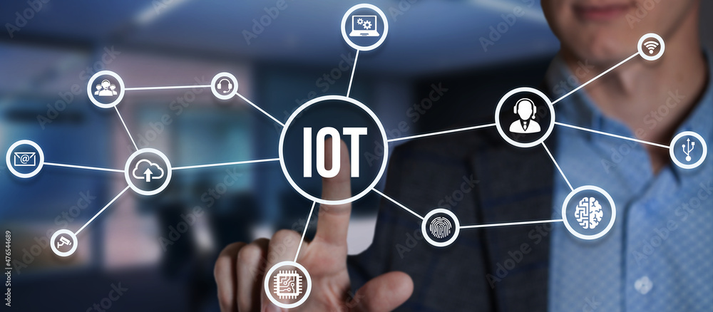 Internet of things - IOT concept. Businessman offer IOT products and solutions. Internet, business, Technology and network concept. Virtual button. Internet of things - IOT concept. Businessman offer IOT products and solutions. Internet, business, Technology and network concept. Virtual button.