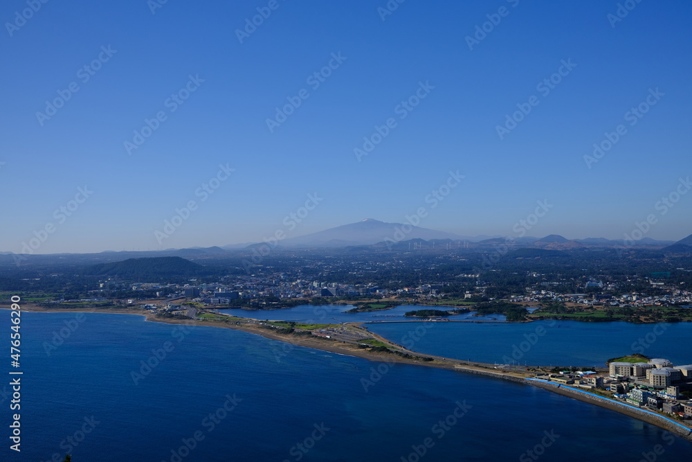 Blue sea and sky scenery of Seongsan Ilchulbong (UNESCO World Heritage Site) in Jeju Island, South Korea