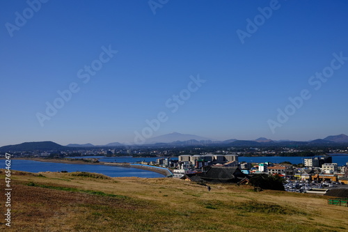 Blue sea and sky scenery of Seongsan Ilchulbong (UNESCO World Heritage Site) in Jeju Island, South Korea