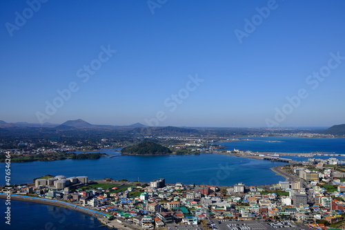 Blue sea and sky scenery of Seongsan Ilchulbong (UNESCO World Heritage Site) in Jeju Island, South Korea © seongjin