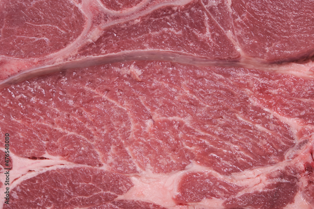 Background and texture, a piece of pork meat close up. Background and texture, a piece of pork meat close up.