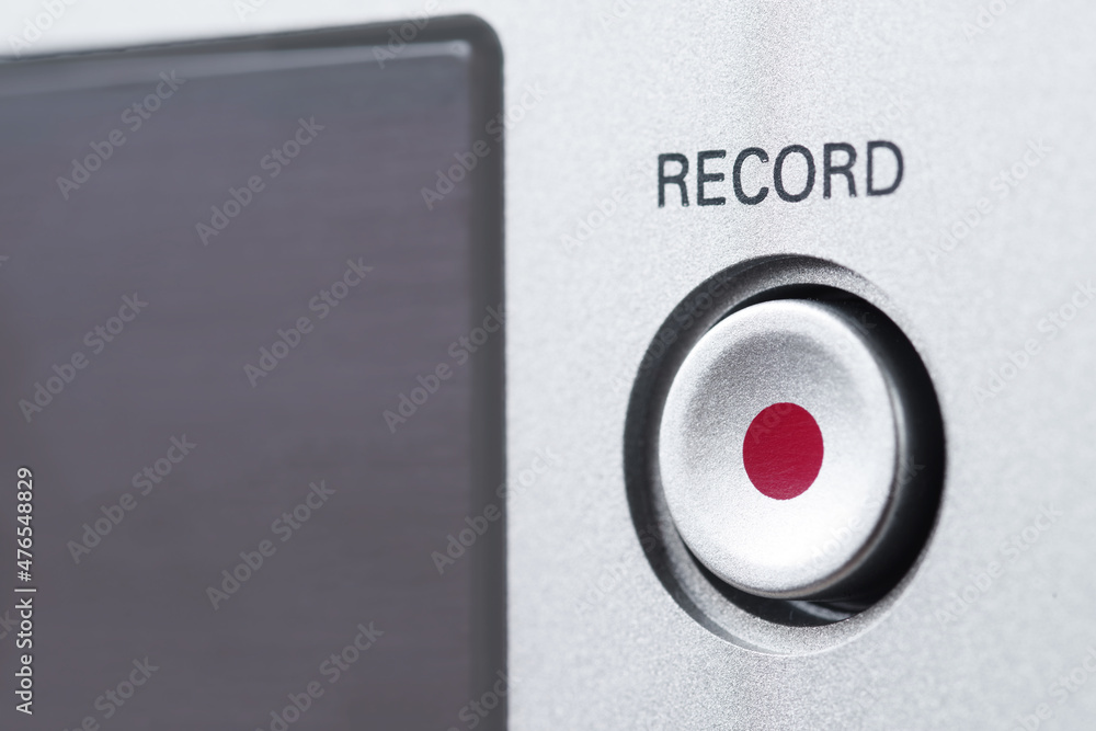 The inscription Record on a control panel above the button with a red ...