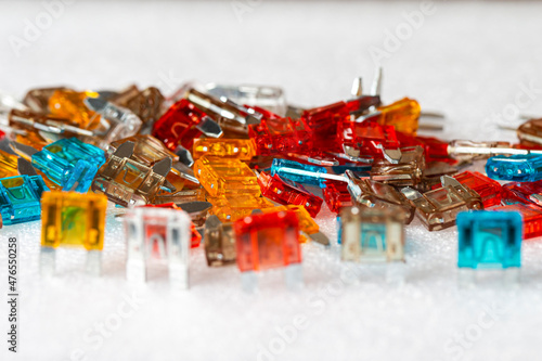 Microelectronics Ideas. Closeup Shot of Batch of Colorful Fusable External Connectors Placed Bulk On White.