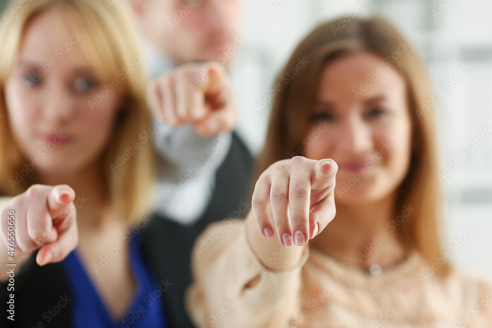 Group of businesspeople pointing their finger at the camera and saying we choose you Group of businesspeople pointing their finger at the camera and saying we choose you