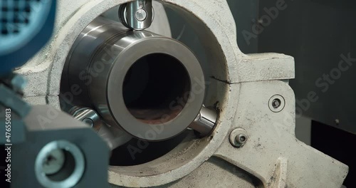 Detail of a lathe cutter with a carbide insert when machining a duralumin cylindrical part. Treatment. photo