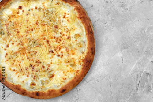 Closeup view of four cheese pizza isolated over white.